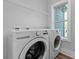 Bright laundry room featuring a window, LG washer and dryer, and overhead storage shelf at 9849 Rich Hatchet Rd, Huntersville, NC 28078