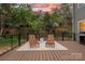 Relaxing outdoor patio with comfortable lounge chairs and a view of the lush greenery, perfect for unwinding at 9849 Rich Hatchet Rd, Huntersville, NC 28078