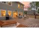 Spacious outdoor patio with comfortable seating, a grill, and lounge furniture, ideal for entertaining guests at 9849 Rich Hatchet Rd, Huntersville, NC 28078