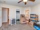 Spacious bedroom with boxes, a ceiling fan, and a view of the bathroom and closet at 1009 Summer Creste Dr, Indian Trail, NC 28079