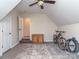 Spacious bonus room features a ceiling fan, and versatile area for storage or recreational use at 1009 Summer Creste Dr, Indian Trail, NC 28079