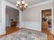 Open dining room with hardwood floors, contemporary chandelier and easy access to the kitchen at 1009 Summer Creste Dr, Indian Trail, NC 28079