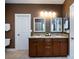 A bathroom with a granite countertop with double sinks and matching framed mirrors at 10125 Loch Lomond Dr, Charlotte, NC 28278