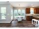 Dining area features a table with seating, stylish light fixture, and bright windows at 10125 Loch Lomond Dr, Charlotte, NC 28278