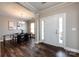 Bright dining room with hardwood floors, modern chandelier, and neutral walls at 10125 Loch Lomond Dr, Charlotte, NC 28278