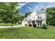Charming two-story home with a well-maintained lawn and a two car garage on a spacious lot at 10125 Loch Lomond Dr, Charlotte, NC 28278