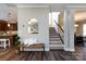 Welcoming foyer with hardwood floors and staircase at 10125 Loch Lomond Dr, Charlotte, NC 28278