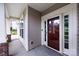 Exterior view of front door and small front porch area with neutral siding at 10125 Loch Lomond Dr, Charlotte, NC 28278