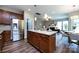 Open kitchen with an island overlooks the living and dining area at 10125 Loch Lomond Dr, Charlotte, NC 28278