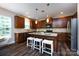 Kitchen island features pendant lights and bar stool seating at 10125 Loch Lomond Dr, Charlotte, NC 28278