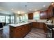 Kitchen island overlooks dining area with stainless appliances and ample storage at 10125 Loch Lomond Dr, Charlotte, NC 28278
