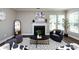 Elegant living room featuring a fireplace, with lots of natural light at 10125 Loch Lomond Dr, Charlotte, NC 28278