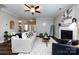 Cozy living room with a fireplace, neutral walls, and hardwood floors at 10125 Loch Lomond Dr, Charlotte, NC 28278