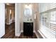 The powder room features a modern vanity with a glass countertop and decorative mirror at 10125 Loch Lomond Dr, Charlotte, NC 28278