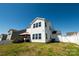 Spacious backyard featuring a covered patio area, manicured lawn, and white vinyl fencing at 1090 River Haven Sw Ave # 61, Concord, NC 28025