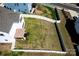 Aerial view of a large, fenced backyard with well-maintained lawn and a covered patio area at 1090 River Haven Sw Ave # 61, Concord, NC 28025