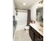 Standard bathroom with a shower-tub combo, single sink vanity, and tiled floor at 1090 River Haven Sw Ave # 61, Concord, NC 28025