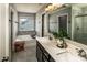 Well-lit bathroom featuring a soaking tub, double vanity, and a separate tiled shower at 1090 River Haven Sw Ave # 61, Concord, NC 28025