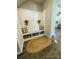 Cozy entryway with a built-in bench, storage baskets, and decorative accents at 1090 River Haven Sw Ave # 61, Concord, NC 28025
