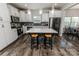 Contemporary kitchen with stainless steel appliances, island, and wooden floors at 1090 River Haven Sw Ave # 61, Concord, NC 28025