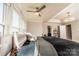 Bright main bedroom with a ceiling fan, large windows, and tray ceiling at 1090 River Haven Sw Ave # 61, Concord, NC 28025