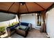 Covered patio with comfortable seating, a modern fire pit table, and stylish decor at 1090 River Haven Sw Ave # 61, Concord, NC 28025