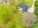 Beautiful aerial view of a brick home, with a large lawn, and a dark roof with a long driveway at 111 Sterling Dr, York, SC 29745