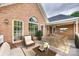 Inviting back porch with brick accents, comfortable seating, and an outdoor dining area at 111 Sterling Dr, York, SC 29745