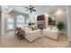 Bright living room with brick fireplace, large windows, hardwood floors and elegant furnishings at 111 Sterling Dr, York, SC 29745
