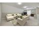 Spacious living room with white and gray walls, plush seating, and ample natural light at 111 Sterling Dr, York, SC 29745