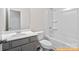 Bright bathroom features a shower and tub combination with a single sink vanity at 6025 Jasmine Branch Rd, Charlotte, NC 28216