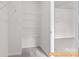 Walk-in closet with wire shelving, carpeted flooring, and ample storage space at 6025 Jasmine Branch Rd, Charlotte, NC 28216