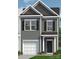 Charming two-story home with a garage, black shutters, and a covered entryway at 6025 Jasmine Branch Rd, Charlotte, NC 28216