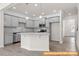 Modern kitchen with gray cabinets, granite countertops, stainless steel appliances, and an island at 6025 Jasmine Branch Rd, Charlotte, NC 28216