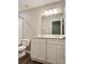Bathroom vanity with double sink, framed mirror and overhead lighting at 12815 Towering Pine Dr, Charlotte, NC 28269
