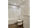 Well-lit bathroom featuring a tub with a shower and a white toilet at 12815 Towering Pine Dr, Charlotte, NC 28269