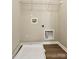 Laundry room featuring utility hookups and a wire shelf for storage at 12815 Towering Pine Dr, Charlotte, NC 28269