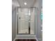 Modern bathroom features a glass-enclosed shower stall, wood flooring and natural light at 12815 Towering Pine Dr, Charlotte, NC 28269