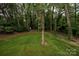 Backyard with tree coverage for privacy at 1721 Balfour Ln, Charlotte, NC 28216