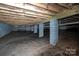 Crawl space featuring block supports, vapor barrier and utilities at 1721 Balfour Ln, Charlotte, NC 28216