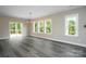 Bright dining area features sliding glass doors leading to a deck and plentiful natural light at 1721 Balfour Ln, Charlotte, NC 28216