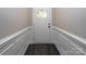 Elegant entryway featuring detailed trim work and modern dark floors at 1721 Balfour Ln, Charlotte, NC 28216