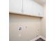 Clean laundry room with cabinets above at 1721 Balfour Ln, Charlotte, NC 28216
