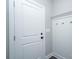 Mudroom with hooks on white board and batten for organization at 1721 Balfour Ln, Charlotte, NC 28216