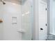 Modern tiled shower featuring a glass door and bronze fixtures at 1721 Balfour Ln, Charlotte, NC 28216