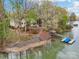 Aerial view of waterfront property with boat dock and lake access, ideal for lakeside living at 176 Sunset Bay Dr, Troutman, NC 28166