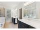 Bright bathroom with double vanity sinks, modern fixtures, and a glass-enclosed shower at 176 Sunset Bay Dr, Troutman, NC 28166