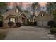Charming home featuring stone accents, a two-car garage, and a welcoming driveway at 176 Sunset Bay Dr, Troutman, NC 28166