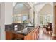Open kitchen featuring a large island with granite countertop and seating and a view to the breakfast nook at 176 Sunset Bay Dr, Troutman, NC 28166