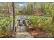 Lake view with dock and seating area with easy access to water activities and scenic beauty at 176 Sunset Bay Dr, Troutman, NC 28166